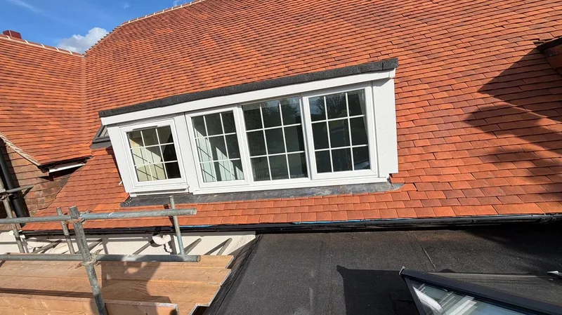 Clay tile reroof and dormer by a roofer in our network